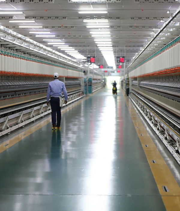 Industrial textile manufacturing plant with modern weaving machines