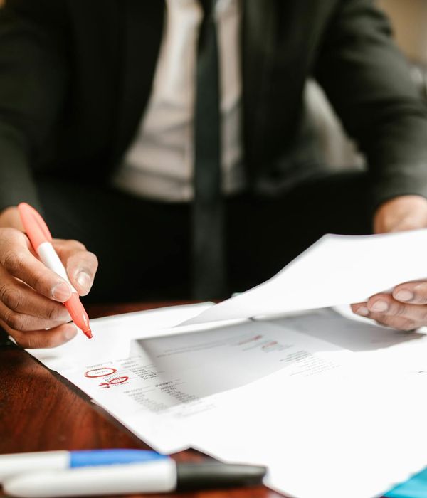 Professional business analysts reviewing international trade documents