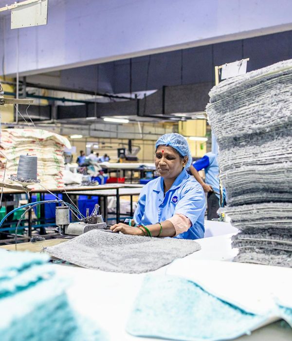 Textile production facility with industrial machinery and fabric rolls